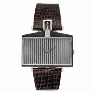 CORUM - Stravagante e prestigioso orologio di forma Rolls Royce in oro bianco 18k, quadrante a motivo di griglia a carica manuale