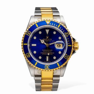 ROLEX - Submariner ref 16613 acciaio e oro, quadrante Blu Soleil movimento automatico con datario, ghiera girevole zigrinata unidirezionale, ancora presenti pellicole parziali e bollino sul fondello, scatola e garanzia