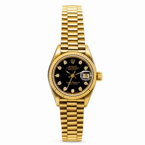 ROLEX - Elegante Deatejust Lady ref 69178 in oro giallo 18k con quadrante nero con indici brillanti e bracciale President con chiusura a scomparsa, accompagnato da scatola e garanzia