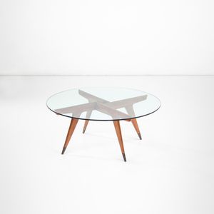 GIO PONTI - Tavolo basso in legno con piano in cristallo.