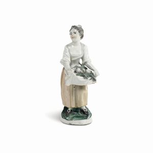 Figurina di venditrice<BR>Torino, Manifattura di Vinovo, probabilmente periodo Hannong, 1776-1779<BR>  - Asta Maioliche e Porcellane - Associazione Nazionale - Case d'Asta italiane
