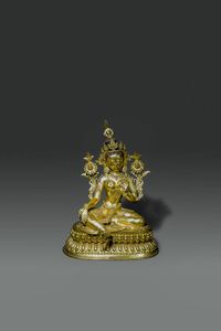 TARA - Grande figura di Tara in bronzo dorato  seduta su doppio fiore di loto  Tibet  XX sec H cm 52x38x27