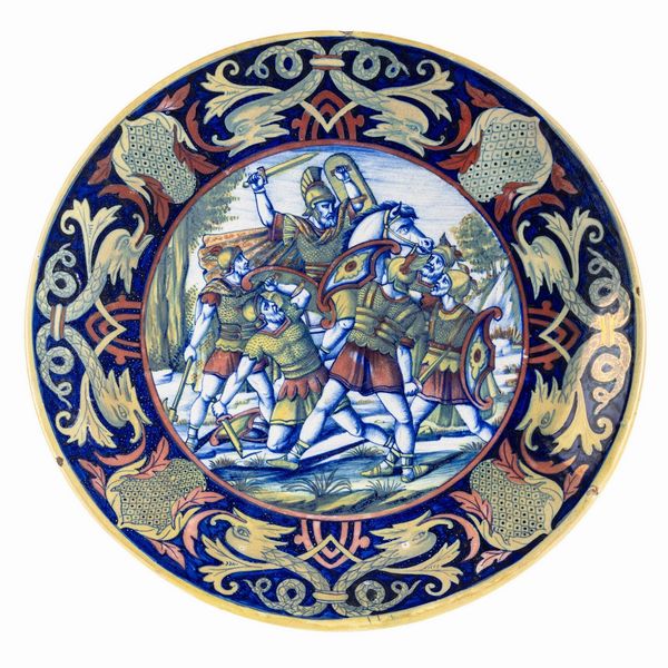 Coppia di piatti istoriati con soldati romani.<BR>Gualdo Tadino, Manifattura Maiolica a Riflessi Lorenzo ed Alberto Rubboli, 1931-1936.  - Asta Maioliche e Porcellane - Associazione Nazionale - Case d'Asta italiane