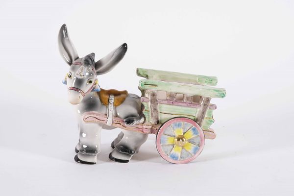 Figurina di asino con carro.<BR>Italia, probabilmente Torino, Manifattura di Elsa Lagorio,  terzo quarto del XX secolo.  - Asta Maioliche e Porcellane - Associazione Nazionale - Case d'Asta italiane
