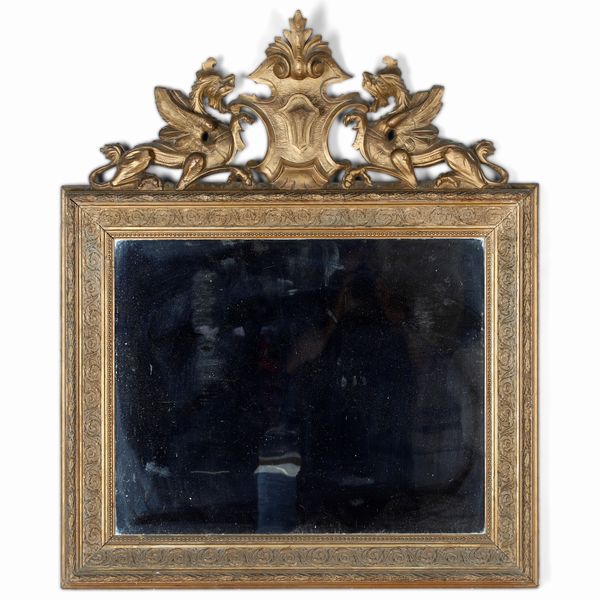 Specchiera in legno intagliato e dorato. XX secolo  - Asta Antiquariato e dipinti - Associazione Nazionale - Case d'Asta italiane