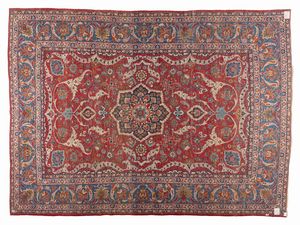 ISPHAHAN : Tappeto persiano con medaglione centrale e motivi fitomorfi su campo rosso, inquadrato da fascia a fondo blu, 1950 circa  - Asta Asta 423 | ARTE ANTICA E DEL XIX SECOLO Online - Associazione Nazionale - Case d'Asta italiane