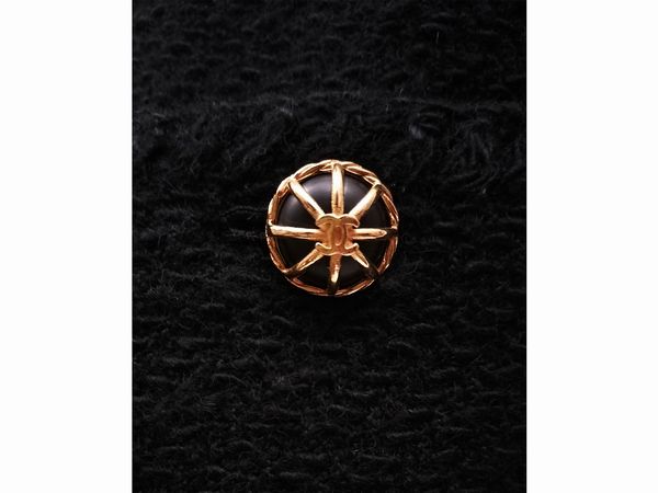 Chanel, Tailleur in tessuto di lana nera boucl�  - Asta Vintagemania - Associazione Nazionale - Case d'Asta italiane
