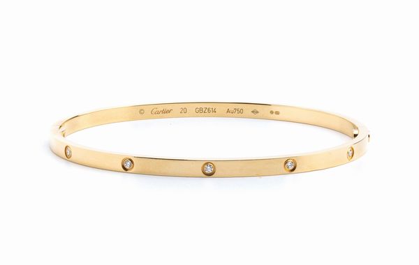 CARTIER, collezione Love: bracciale rigido in oro e diamanti  - Asta Gioielli, orologi, argenti e penne - Associazione Nazionale - Case d'Asta italiane