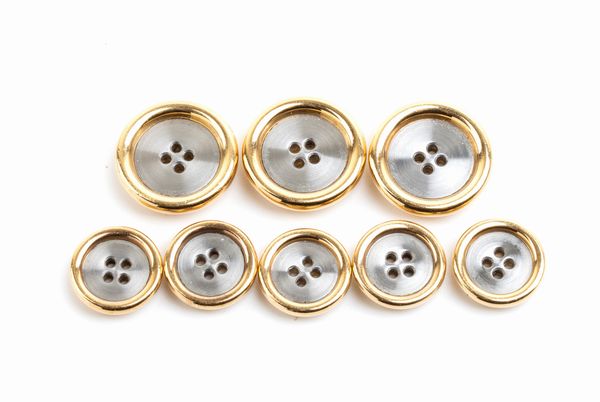 BULGARI: set di 8 bottoni in oro e acciaio  - Asta Gioielli, orologi, argenti e penne - Associazione Nazionale - Case d'Asta italiane