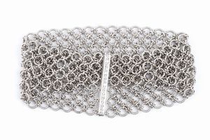 CELIN: bracciale a fascia morbida in oro  - Asta Gioielli, orologi, argenti e penne - Associazione Nazionale - Case d'Asta italiane