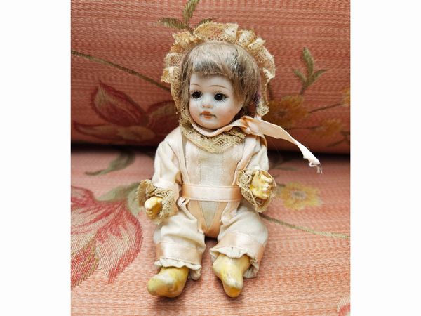 Quattro bamboline beb�  - Asta Bambole e Balocchi - Associazione Nazionale - Case d'Asta italiane