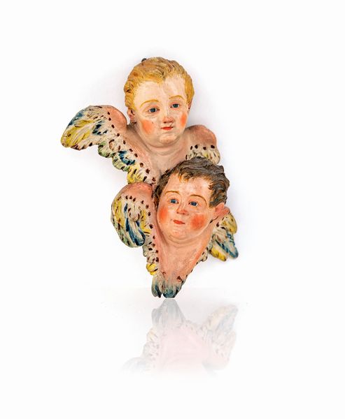 Due teste di cherubino unite in terracotta policroma  - Asta Dalla Collezione Antonio Latini e altre provenienze Antichi Pastori da Presepe, Accessori e libri sul tema - Associazione Nazionale - Case d'Asta italiane