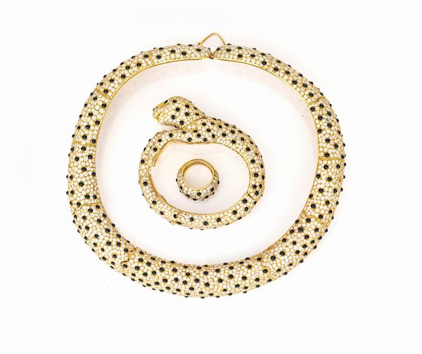 Parure a soggetto animalier di girocollo, bracciale ed anello in oro, brillanti ed onice  - Asta Asta Gioielli e Orologi - Associazione Nazionale - Case d'Asta italiane