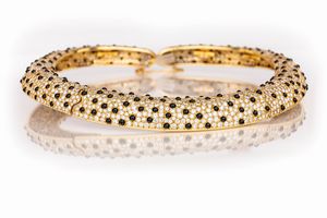 Parure a soggetto animalier di girocollo, bracciale ed anello in oro, brillanti ed onice  - Asta Asta Gioielli e Orologi - Associazione Nazionale - Case d'Asta italiane
