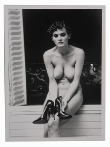 HELMUT NEWTON - Sylvia examining her high heeled shoes in my studio, Parigi, 1981