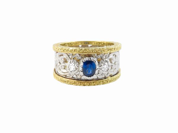 Anello a fascia in oro bianco e giallo con diamanti e zaffiro  - Asta Gioielli e Orologi - Associazione Nazionale - Case d'Asta italiane