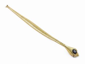Bracciale animalier tubogas in oro giallo con zaffiro e rubini  - Asta Gioielli e Orologi - Associazione Nazionale - Case d'Asta italiane