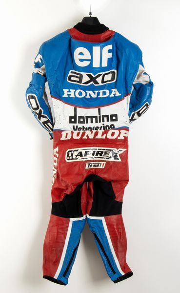 Motociclismo, Loris Capirossi , tuta da gara e casco autografati  - Asta Antique Toys & Sports Memorabilia - Associazione Nazionale - Case d'Asta italiane