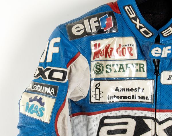 Motociclismo, Loris Capirossi , tuta da gara e casco autografati  - Asta Antique Toys & Sports Memorabilia - Associazione Nazionale - Case d'Asta italiane