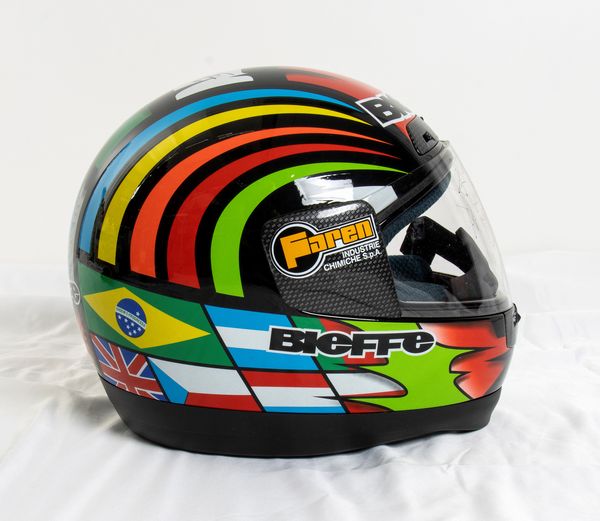 Motociclismo, Loris Capirossi , tuta da gara e casco autografati  - Asta Antique Toys & Sports Memorabilia - Associazione Nazionale - Case d'Asta italiane