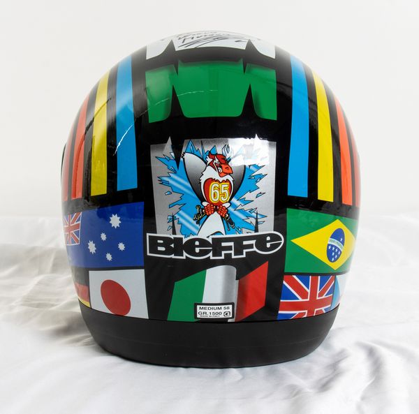 Motociclismo, Loris Capirossi , tuta da gara e casco autografati  - Asta Antique Toys & Sports Memorabilia - Associazione Nazionale - Case d'Asta italiane