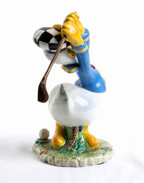 DISNEY ceramica Zaccagnini , PAPERINO golfista  - Asta Antique Toys & Sports Memorabilia - Associazione Nazionale - Case d'Asta italiane