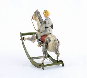 Gunthermann, Bambino su cavallo a dondolo  - Asta Antique Toys & Sports Memorabilia - Associazione Nazionale - Case d'Asta italiane