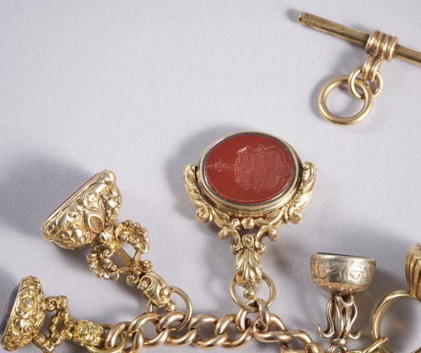 . : Raro e squisito bracciale con n. 13 sigilli e catena per allungo a collana in oro basso titolo.  - Asta GIOIELLI - OROLOGI - ALL I WANT FOR CHRISTMAS Online - Associazione Nazionale - Case d'Asta italiane