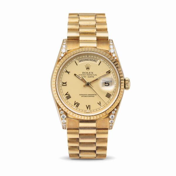 ROLEX : Raro e prezioso Daydate ref 18338 in oro giallo 18k con diamanti incastonati sulle anse, quadrante champagne opaco con numeri Romani applicati corredato di garanzia originale  - Asta Orologi da Polso - Associazione Nazionale - Case d'Asta italiane