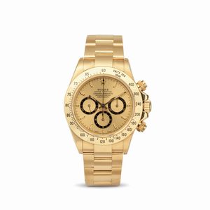 ROLEX - Iconico e ricercato Cosmograph Daytona ref 16528 in oro giallo 18k, quadrante champagne con contatori neri, lunetta tachimetrica e tasti a vite, bracciale Oyster