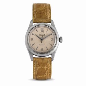 ROLEX - Classico orologio da polso a carica manuale con quadrante argent� a nido d'ape, corredato da scatola