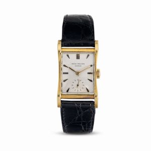 PATEK PHILIPPE - Elegante orologio di forma rettangolare ref 2456 in oro giallo 18k, carica manuale, quadrante argent� con indici applicati e piccoli secondi al sei