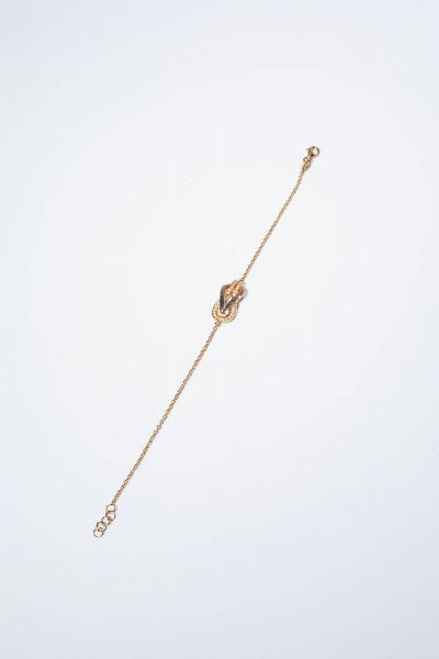 BRACCIALE : Peso gr 3 5 Lunghezza cm 17 5 in oro rosa con nodo al centro in diamanti taglio brillante per totali ct 0 12 ca  probabile colore G-H  purezza IF-VVS.  - Asta Gioielli - Associazione Nazionale - Case d'Asta italiane