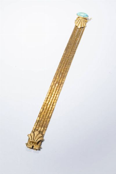 BRACCIALE : Peso gr 45 6 Lunghezza cm 20 composto da cinque fili di segmenti satinati in oro giallo. Chiusura con turchese cabochon.  - Asta Gioielli - Associazione Nazionale - Case d'Asta italiane