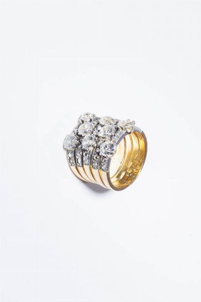 ANELLO : Peso gr 11 2 Misura 14 (54) in oro rosa e oro bianco  inizi XX secolo  composto da cinque fasce in rosette e diamanti taglio vecchio per totali ct 3 0 ca.  - Asta Gioielli - Associazione Nazionale - Case d'Asta italiane