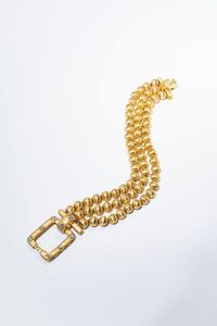 BRACCIALE - Peso gr 55 1 Lunghezza cm 17 in oro giallo  composto da tre fili di sfere satinate. Chiusura di forma rettangolare  [..]