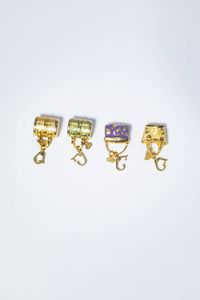 ROSATO - Peso gr 19 3 Lotto di quattro charms in oro giallo e smalti policromi  firmati Rosato  a forma di piccole borse  [..]