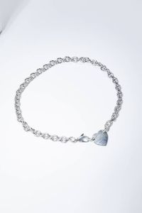TIFFANY & CO. - Peso gr 54 3 Girocollo in argento 925/1000  firmato Tiffany & Co  lavorato a maglia ad anelli; al centro cuore  [..]