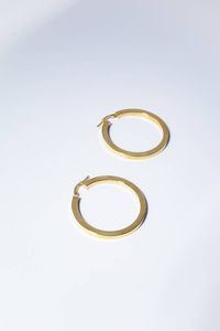 COPPIA DI ORECCHINI - Peso gr 4 2 Diam. interno cm 3 in oro giallo a forma di cerchio.