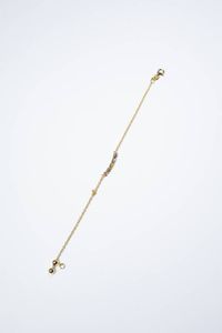 BRACCIALE - Peso gr 2 8 Lunghezza cm 17 in oro giallo con al centro inserto rigido con pietre fini a decoro.