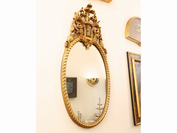 Specchiera in legno intagliato e dorato  - Asta Una casa fiorentina. Tra tradizione e modernit Le collezioni, i dipinti, gli arredi - III  - Associazione Nazionale - Case d'Asta italiane