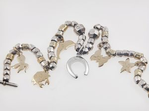 Pomellato. Bracciale Dodo con charms e piccoli diamanti  - Asta Gioielli  - Associazione Nazionale - Case d'Asta italiane