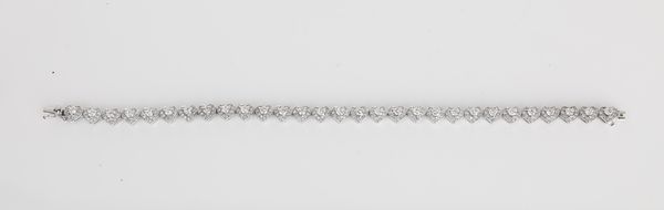 Bracciale tennis a cuori in oro e brillanti  - Asta Asta a Tempo - Gioielli e Preziosi - Associazione Nazionale - Case d'Asta italiane