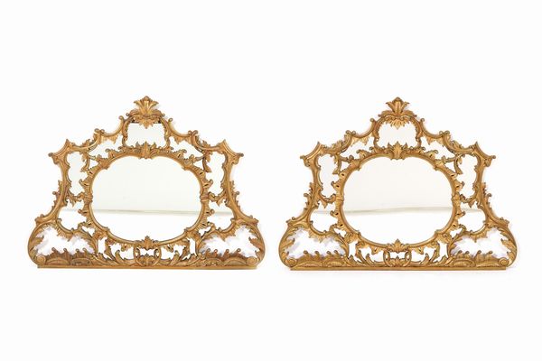 Coppia di specchiere in legno intagliato e dorato. Inizio XX secolo  - Asta Decoro in stile antico Palazzo Pugliese - Associazione Nazionale - Case d'Asta italiane
