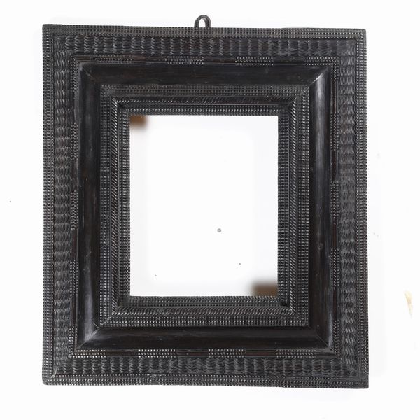 Cornice guilloch in legno ebanizzato, XVIII secolo  - Asta Cornici Antiche - Associazione Nazionale - Case d'Asta italiane
