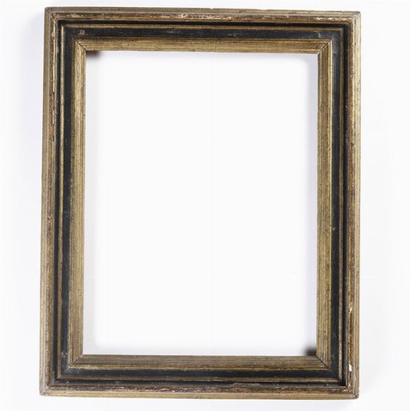 Cornice in legno intagliato, dorato ed ebanizzato. Centro Italia XVII secolo  - Asta Cornici Antiche - Associazione Nazionale - Case d'Asta italiane