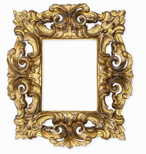 Cornice in legno intagliato, traforato a volute e dorato. Toscana, fine XVII secolo  - Asta Cornici Antiche - Associazione Nazionale - Case d'Asta italiane