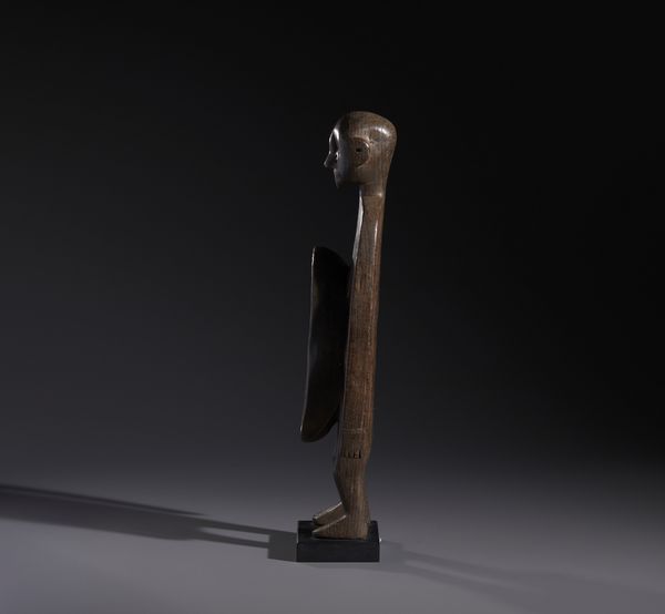 Koro - Nigeria : Nello stile di Scultura antropomorfa con doppia coppa rituale nella parte addominaleLegno duro a patina scura  - Asta Asta 444 | AFRICA, OCEANIA E AMERICHE - ARTIGIANATO AFRICANO: VARI COMMITTENTI E SELEZIONE DALLA COLLEZIONE BARTOLOMUCCI Online - Associazione Nazionale - Case d'Asta italiane