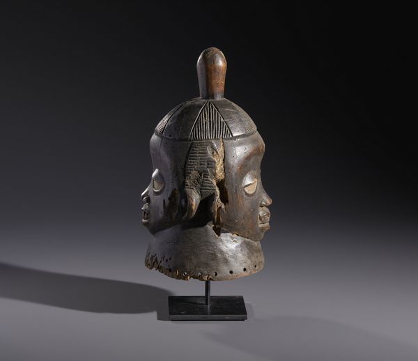 Yoruba -Nigeria : Nello stile diMaschera antropomorfa  gianeiforme in legno a patina marrone  - Asta Asta 444 | AFRICA, OCEANIA E AMERICHE - ARTIGIANATO AFRICANO: VARI COMMITTENTI E SELEZIONE DALLA COLLEZIONE BARTOLOMUCCI Online - Associazione Nazionale - Case d'Asta italiane