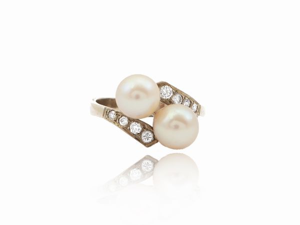Anello contrari� in oro bianco con diamanti e perle coltivate  - Asta Gioielli e Orologi - Associazione Nazionale - Case d'Asta italiane